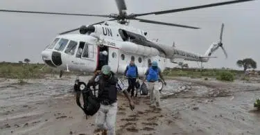UN officials disembark from a helicopter near the town of Kurtunwaarey in the Lower Shabelle region of Somalia on November 20. The United Nations today conducted an inter-agency assessment mission in the recently liberated town of Kurtunwaarey, as part of an ongoing effort to assess the humanitarian needs of civilians living in former Al-Shabaab controlled areas. UN Photo / Tobin Jones